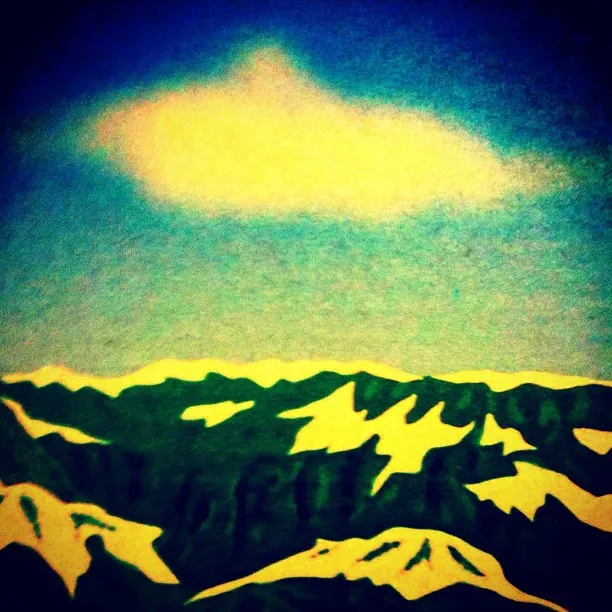 Colorful stylized illustration of a mountain range with snow patches under a bright blue sky and a single fluffy cloud.