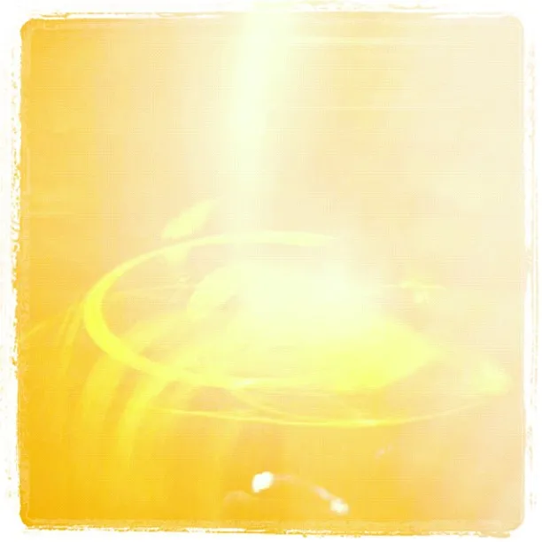 Bright yellow and white abstract image with intense overexposure and circular light streaks.